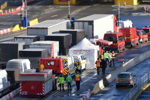 Freight vehicles line up near the entrance to the port of Dover on the south-east coast of England on December 24, 2020.
