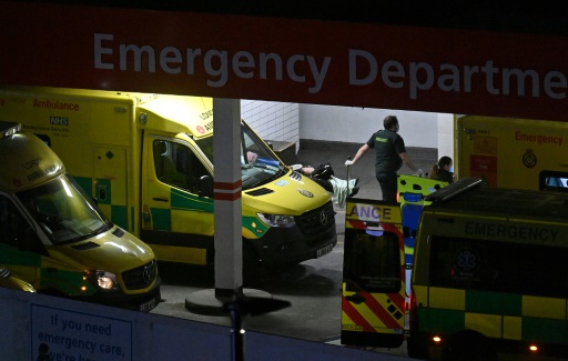 Paramedics transport a patient to the emergency department of a London hospital, January 7, 2021
